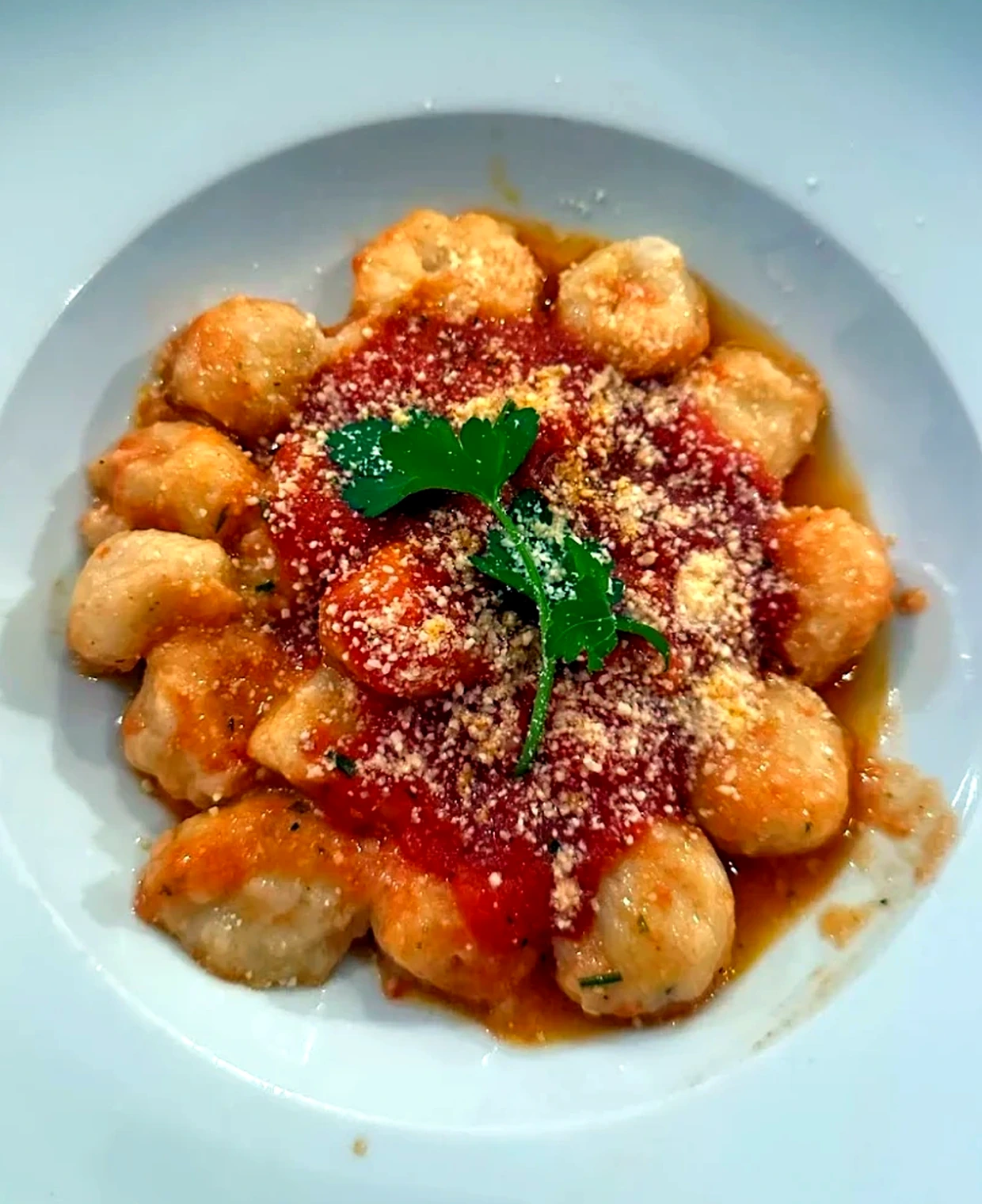 Gnocchi with tomato ragu, parmesan and parsley