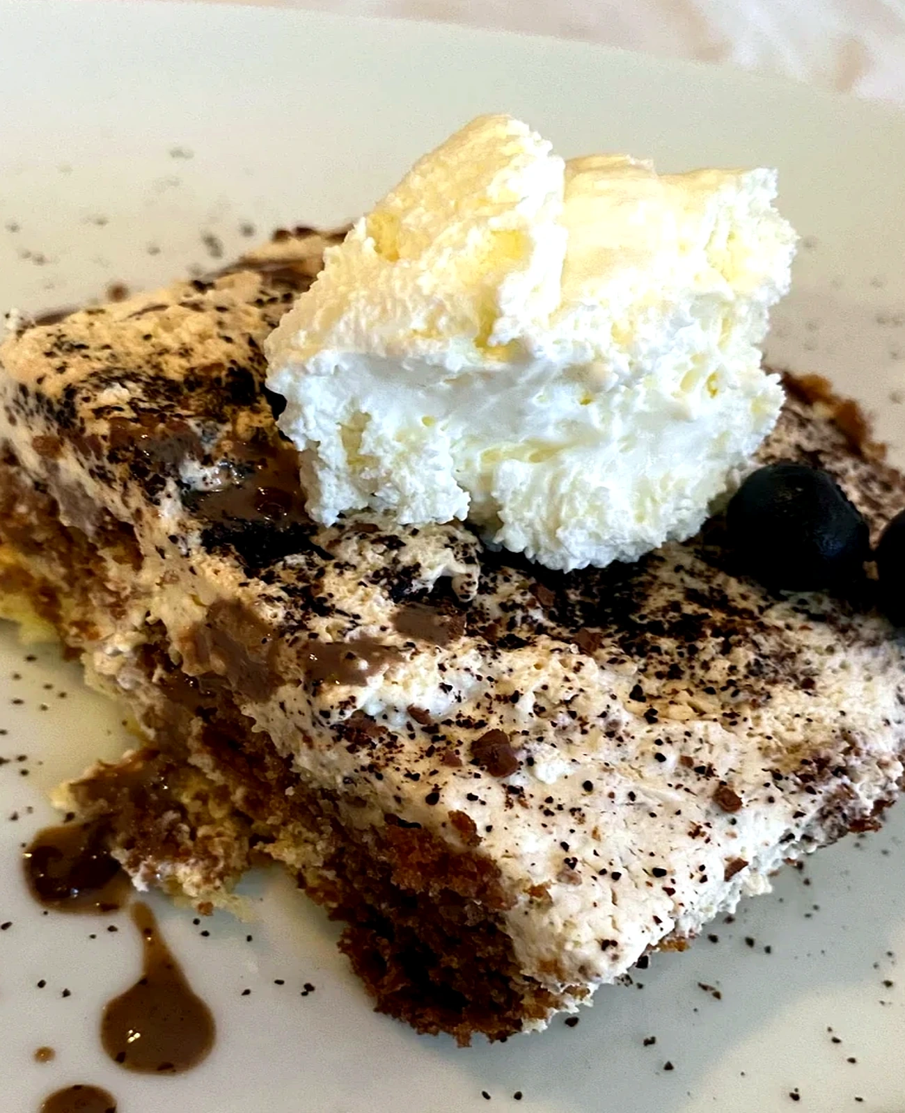 House tiramisu with cream and cocoa
